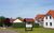 Ferien-Residenz am Nationalpark Wohnung 6, Ferienwohnung in Gingst auf Rügen - Vorderansicht mit Carport und Fahrradschuppen