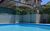 Ferienwohnung Vacanze in Colico - Ansicht von Außen Wohnung hinter Pool