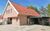 Ferienhaus &#039;Stangenberg-Perle&#039; in Wischuer-Biendorf - Außenansicht mit Carport und 2 Wallboxen