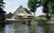 Ferienwohnung am See -  Fischerhof Vipperow, Ferienwohnung Mritzarm in Sdmritz OT Vipperow - Blick vom Bootssteg auf die Wohnungen