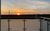 Ferienwohnung de Glemfisk in Dorum-Neufeld - Deichblick vom Balkon mit Sonnenuntergang