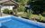 Ferienhaus Kamin in Rheinböllen - Gartenansicht mit Pool