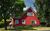 Ferienwohnung im roten Haus, Ferienwohnung in Krslin bei Wolgast - Auenansicht Giebelseite