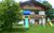 Ferienwohnung Putzer in Halblech - Südansicht mit Terrasse/Garten/Eingang