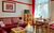 Stadtappartement Waren - Ferienwohnung Rote Rose in Waren (Müritz) - Wohnküche mit Esstisch und Sofagruppe